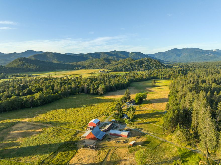 Located in Southern Oregon's Applegate Valley, this 112.7-acre ranch offers a rare blend of beauty, function, and privacy. The land includes 42 acres of irrigation rights from Williams Creek, with gently rolling pastures, mature trees, and three ponds. The main home is a spacious 3,771 sq ft ranch-style residence with attached guest quarters, while a second 2-bedroom home provides flexible living or rental use. Over 13,000 sq ft of barns and outbuildings support livestock and ag operations, including a horse barn, historic hay barn, and multiple sheds. The setting offers exceptional recreational opportunities, including hunting, riding, and exploring your own private valley. Zoned EFU and ideally suited for grazing, hay, or vineyards, this is a working ranch with incredible potential. Just minutes from Grants Pass and the heart of Southern Oregon's wine country, this property offers rural lifestyle and a sought after location!