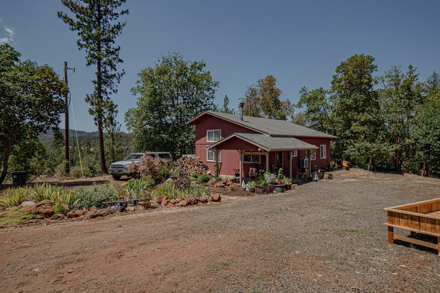 This well-maintained home sits in the hills of Eagle Point w/beautiful views and offers some peace and quiet! At 1296 sq ft this home features 1 bedroom downstairs w/a full bathroom, walk-in shower, laundry room and walk-in closet. Upstairs offers a big loft w/an attached full bathroom, shower/tub combo and a huge closet/storage area. Open concept living with lots of natural light. In 2019 the home was updated w/vinyl dual pane windows, laminate flooring, septic and an energy efficient heating/cooling mini split system. Most recent updates include exterior paint, solid wood staircase and loft railing, finished full bathroom upstairs, pantry storage under stairs, certified wood stove and an expansion of the storage/workshop outbuilding. Property is just under 10 acres, offers plenty of space for toys, garden needs, recreational uses and has full RV hook up with a separate septic.