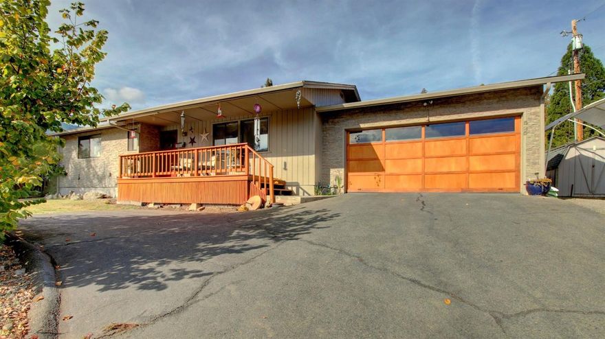 Extremely Well-Cared-For Stick Built Home with Incredible Views of the Mountainside - Only Blocks from Wonderful Rogue River. Just minutes to Medford or Grants Pass. Extremely Energy Efficient home, fully-insulated top-to-bottom with 2x6 construction throughout. The gorgeous covered front deck leads you into this home with tons of custom features including custom front stone-look'' siding, Hunter Douglas pull-down window coverings, laminate flooring throughout, newly added breakfast nook, updated bath fixtures & some newly updated vinyl windows. Additional pantry area in back of attached 2-car garage w/extra custom shelving +plenty of parking. Two extra storage buildings (8x8 & 8x4). Custom interior paint, partially fenced, grass in front and back yard. Bring your clients to this house, they will love it!