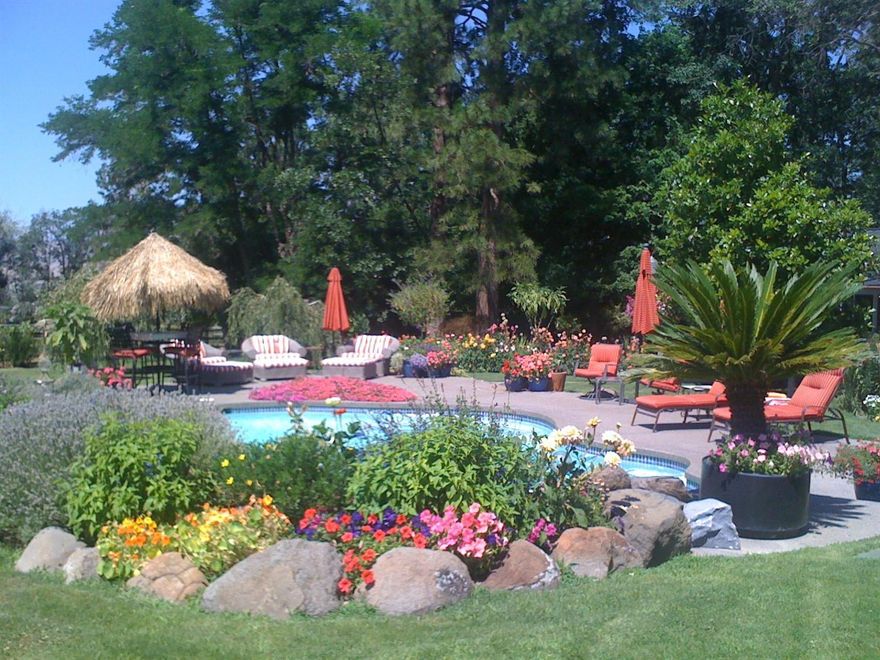 A rare find in Ashland, 14.74 acres right out of the city limits. Spectacular park like manicured grounds Gorgeous solar heated pool with waterfall. . Two additional tax lots, TID irrigation. fabulous views and city water. Oversized garage with an office, a pool house with bath, 2 stall barn and with lots of storage. Green house and a pond. The single level home is lovely with some recent upgrades.