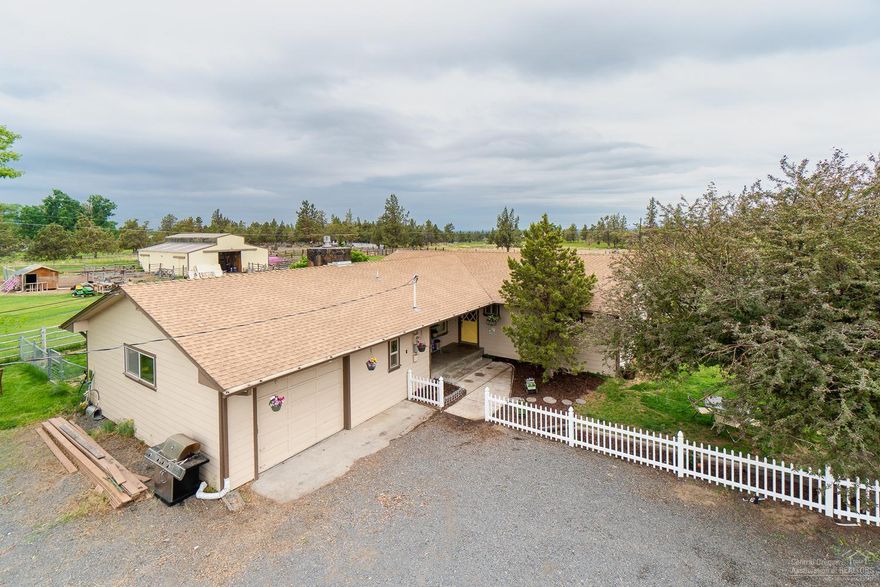 Turn key hobby farm on the edge of Redmond w/ Cascade Mtn Views! Bring your animals and enjoy the privacy & convenience that is right here. Home has been remodeled and opened up for functionality. New granite counter tops, SS appliances, slide in range, bar seating & plenty of storage. Back deck has a private & covered hot tub. Laundry area has its own room off the garage. Living room & family room for entertaining w/gas fire place. 6 stall barn w/ tack room, heated waterers & corrals. Bring your critters! Well & septic tests & home inspection complete - ready for the holidays.