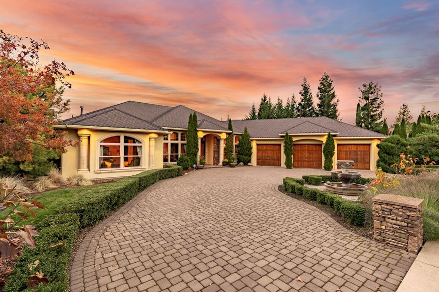 A one-of-a-kind gorgeous custom home with beautiful views of Roxy Ann and the city. It is a wonderful property for indoor and outdoor entertaining with two levels of decks. The many architectural details include oversized picture windows and a gourmet's dream kitchen. It is an open floorplan, lots of natural light. The main floor has a master suite, guest suite, kitchen, living room and a large office. The downstairs has a theatre/media room, two guest rooms, a 1000 sq ft shop, and a 1000 sq ft gym. There is travertine tile throughout the home, and the crown molding and base molding details are exquisite. All bedrooms have walk in closets, there is custom lighting throughout, all appliances stay including the Thermadour refrigerator, and gym workout equipment. The large master suite has a jetted tub, plus a steam shower. The front and backyards are beautifully landscaped, including a front circular driveway with a charming fountain, and oversized 3 car garage. A must tour home!