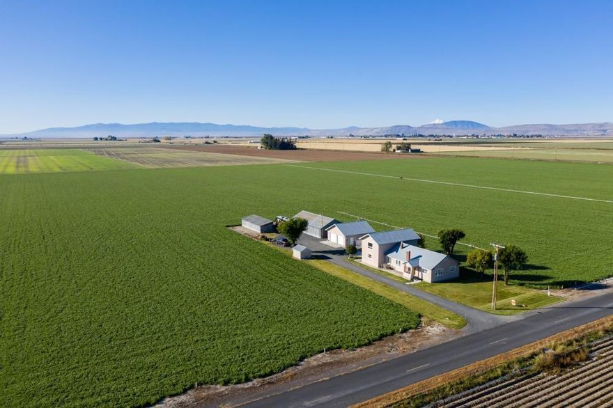 Well-maintained 2780 square-foot house, with four bedrooms, two and two half baths on 140.24 acres. Picturesque views of Mount Shasta, Horse Mountain and the surrounding hills, located approximately 2.5 miles north east of Tulelake, California. The property includes 123.3 acres that is irrigated with TID water (class A); two pumps; 30,000 CWT potato cellar; 750-800 ton hay barn; Shop; storage shed; and a two car detached garage with half bath. The property is sold on an as is where is basis buyer must make offer based upon buyers personal inspection of the property and not upon any representations or warranties of seller or agents.