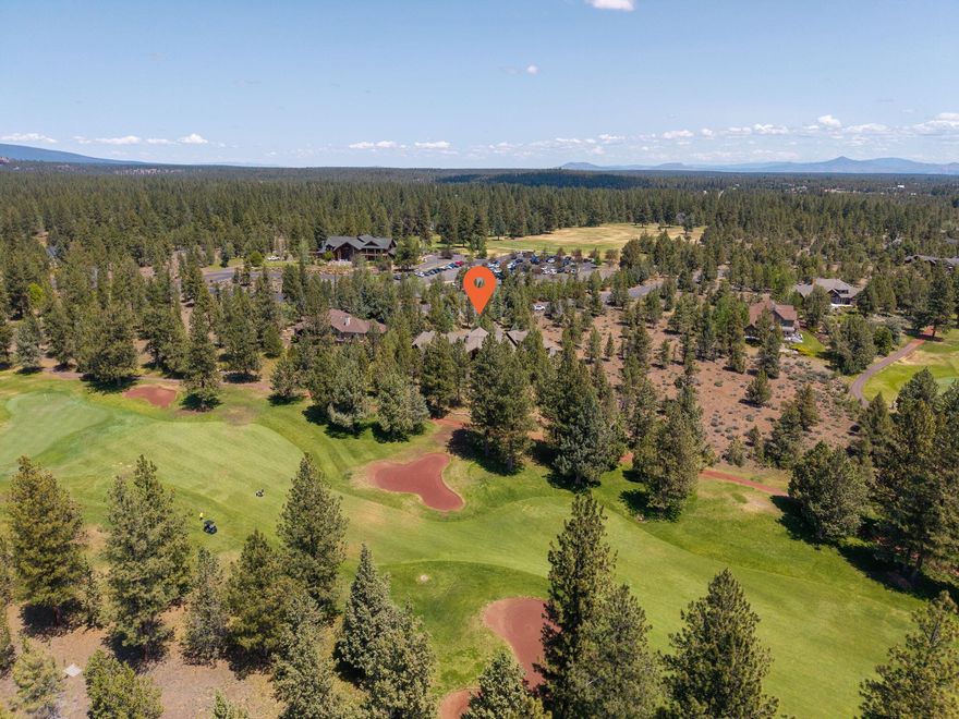 This is an exceptional home nestled in the prestigious Aspen Lakes Golf Community in Sisters, OR. This timeless Northwest lodge style home is all one level living, with a large bunkroom w/wet bar & full bath upstairs. Showcasing unparalleled craftsmanship w/ wood beams/accents & custom built-ins throughout. Thoughtfully designed open concept, with dining area & large kitchen w/ eating bar & nook. Three bedroom ensuites on the main level that are perfect for all of your guests! A dedicated office w/golf course views. Soaring vaulted ceilings & expansive windows flood the interior w/natural light & showcase the stunning outdoor scenery. Wide hallways, rich wood flooring & generous closet space enhance both comfort & function. Step outside to a recently refinished wood wrap around back deck, ideal for entertaining and taking in views of the fairways & Cascade Mtn views. The oversized 3 car garage offers storage w/ a workshop or hobby space. This is refined mountain living at its best!