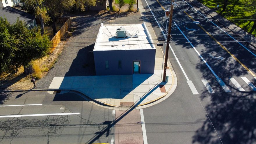 Many possibilities for this C2-zoned property in central Madras conveniently located across from a community park while only two blocks from main street. The mixed-use zoning allows for a live/work opportunity while being in the urban renewal district enhances potential renovation/restoration opportunities with the city. Per city discussions, the property has potential for conversion into residential use following city codes - buyer to confirm. The 1,000sqft. building is on a corner lot with its own parking area. Subject to tenant lease; on a 1-year lease of $1,000/month. Seller has the right to do a 1031 tax-deferred exchange at no cost to the buyer.