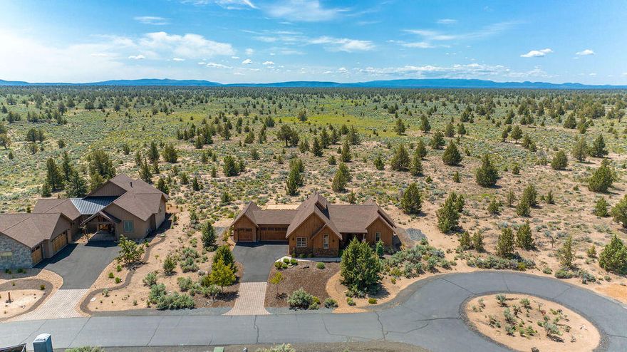 Melding beautifully with its stunning Brasada Ranch location, this single story home is the perfect backdrop for your next adventure or relaxing retreat. Being sold as a fully turnkey and operational vacation rental, the wonderfully curated furnishings and accessories are all included in the sale. Three bedrooms, three full bathrooms and a vaulted great room floor plan provide a spacious living experience. The large granite island, abundant cabinetry and stainless steel appliances make this kitchen a pleasure to cook in & a natural gathering spot. Plentiful windows overlook a private outdoor living area that includes a covered patio, built-in fire ring, hot tub and bocce ball court. From every spot on this property, you'll fall in love with the incredible night skies, the wonderful sense of privacy and the expansive view of resort common area and BLM land that backs this half acre lot. Brasada Ranch offers exceptional amenities including golf, restaurants, pool, spa, gym & much more!