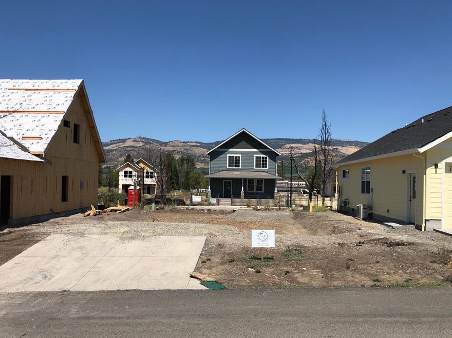 Highly sought after clean build-ready vacant lot in Talent's Old Bridge Village. The lot can accommodate a 2 or 3 bed, 2 bath residence with a two car garage. The back side of the vacant lot borders Cuffe Alley. The convenient location provides direct community access to the Wagner Creek open space and it's just a few blocks to all that Downtown Talent has to offer!