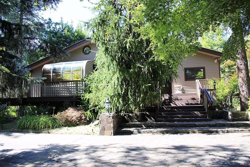 Don't miss this opportunity to own a little piece of paradise on the Applegate River! This contemporary 3016 sq ft home offers 4 bedrooms, 2 1/2 baths, open floorplan, with wonderful T&G vaulted ceilings, spiral staircase to office loft, TONS of storage, lots of light, and HUGE dual access garage space, with wine cellar opportunities. All surrounded by natural and elegant landscaping; a fabulous outdoor kitchen and gazebo area, resting over a wonderful pond. Winding and secluded pathways take you to private river access. Fish from wrap-a-round decks and relax in the hot tub. This home sits on 4 acres with 1.5 acres irrigated, has new paint and new carpet.