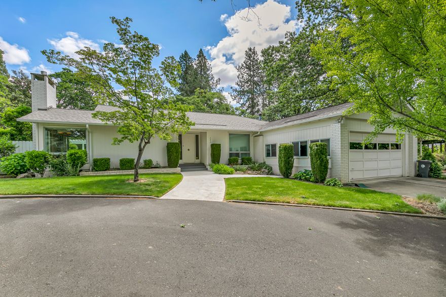 Beautifully upgraded 4 bedroom, 2 bathroom single-level home on a .34-acre lot in Old East Medford with a heated in-ground gunite swimming pool. Nearly fully remodeled. Excellent floor plan offering living & family rooms with gas fireplaces, plus formal dining room & total privacy. Features include marble-tile entry, white oak floors, high-end fixtures, granite waterfall counters, custom soft-close cabinets, stainless appliances, Milgard windows, Levolor shades, skylight atrium, newer HVAC, & newer roof. Spacious primary suite opens to a private courtyard & bathroom has heated tile floors, soaking tub, dual sinks, walk-in closet, & custom tile shower. Private back yard, mature trees, deep pool w/equipment, & oversized 2-car garage w/painted floors, high ceilings, storage, & built-ins. A rare East Medford gem!