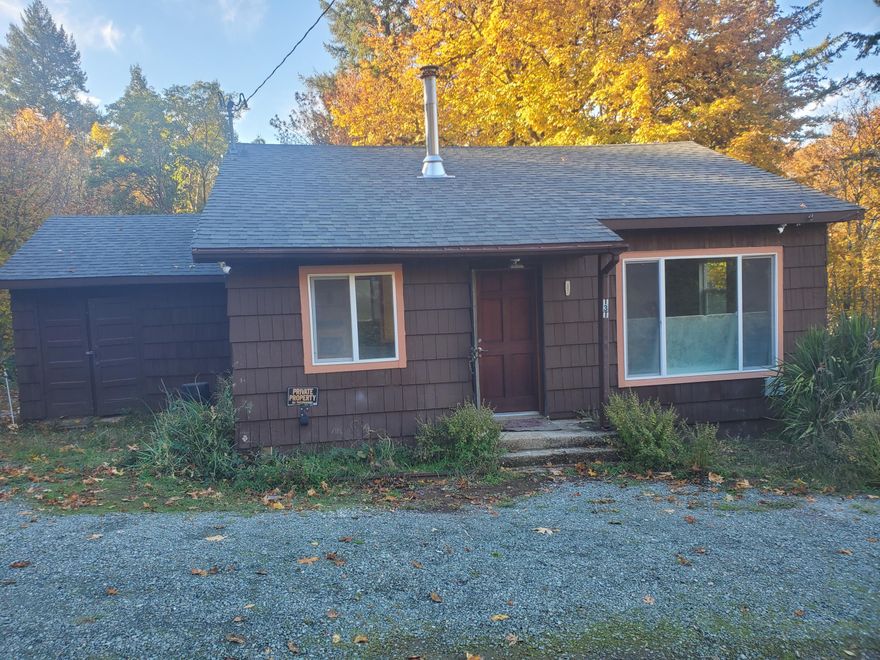 Delightful 2-bedroom, 1.5-bath home nestled in a peaceful, well-situated neighborhood. Enjoy the warmth and character of a cozy wood-burning fireplace, perfect for chilly Oregon evenings. Recent upgrades include a new roof (2020) and a freshly built deck, ideal for relaxing or entertaining. The spacious, fully fenced lot offers privacy and ample room for gardening, pets, or play. Whether you're starting out, downsizing, or seeking a serene getaway, this inviting home checks all the boxes.  The seller is a licensed Oregon real estate broker.