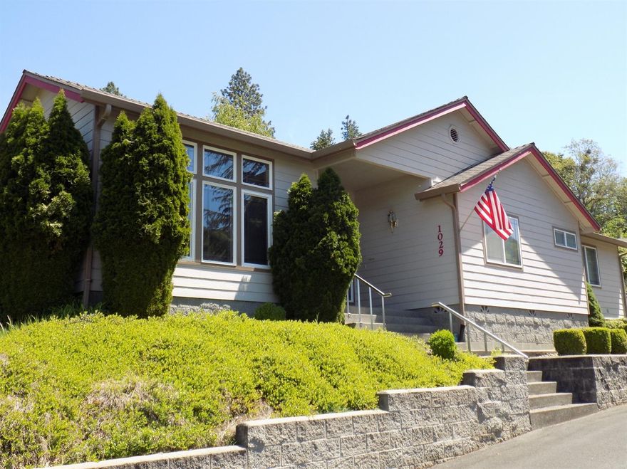 The minute you drive up to this beautiful home you know you are in for something special. Ceiling to floor windows in the living and dining room take advantage of the amazing views of the mountains. The open floor plan just adds to the cheery and bright atmosphere of this home. The sun room off of the kitchen makes for a great guest room and when you add in the two shops, and gorgeous landscaping with cascading waterfall in the back yard, this is one you won't want to miss!