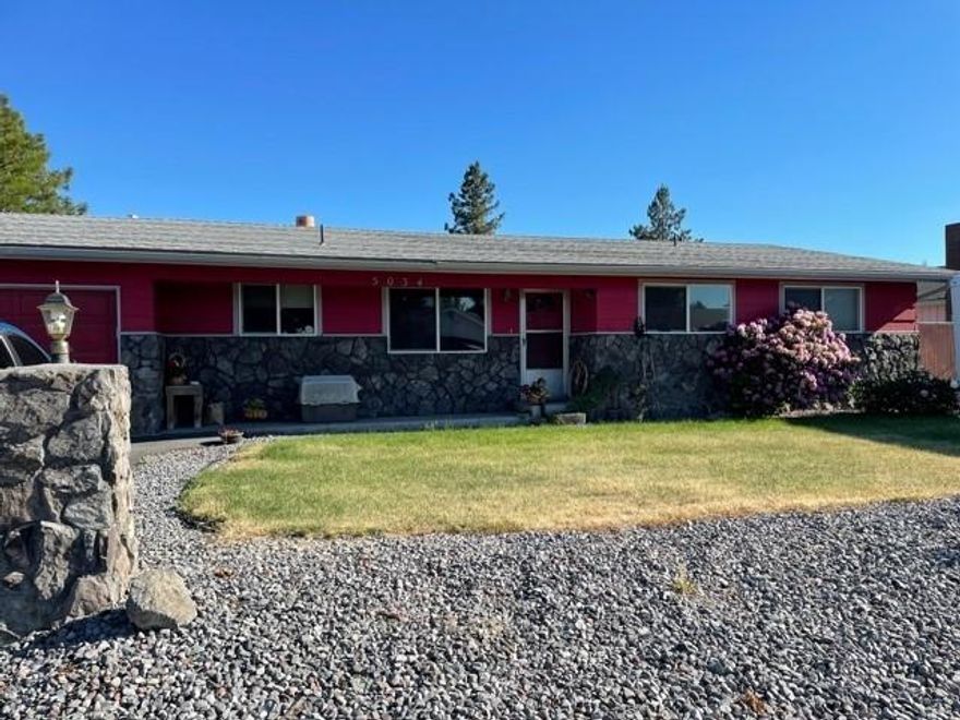 : Nice 3 bedroom, 2 bathroom home in the suburbs. Featuring a large family room and living room with double wall fireplace, separate dining room and partially updated kitchen with newer upper cabinets, laminate counters, and laminate flooring throughout. Good size laundry/mud room. Large primary suite with double closets, and bathroom with some updates. Situated on a large lot, fully fenced back yard with double gated access and back deck for entertaining. This home has great potential to make it your own!