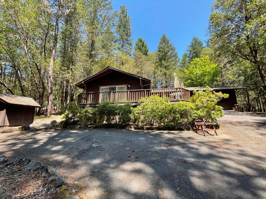 Country living! Just under 2 acres this single level home is located on a dead end country lane just outside of town and close to all services!  There is a paved circular driveway, large front deck and spacious sunny rear patio.  The home itself has had some updating and a large family room was added to the rear of the house off of the kitchen.  Three bedrooms, 2 full baths, nice living room with electric fireplace.  Lots of windows to take in the treed setting. There are a few garden sheds on the property for yard implement storage and the house is set back nicely from the street. Plenty of RV and or boat parking too.