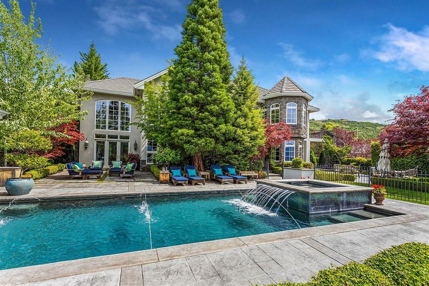 Elegant Old World Masterpiece w/incredible detailing & breathtaking views. Grand double dr entry w/solid marble staircase, 20ft ceilings, clearstory windows & soaring limestone frplace. Formal living & dining, Butlers pantry, temp controlled wine rm & resort style salt water pool w/many outdr entertainment areas & lush landscaping. The center island cook's kitchen offers Cherry cabinets, Viking appls & walk-in pantry w/sunny breakfast nook, inviting family rm & outdr kitchen. Upstairs mezzanine w/wrought iron railing leads to an expansive 1000sf master ste complete w/frplace, coffee bar, lg custom closet, sunny veranda & a spa-like bath w/Lapis Lazuli cntrs, steam shower & jetted tub! Hand-plastered radius walls, Alabaster fixtures, French drs, wonderful built-ins, beautiful tiled bths, dual laundry rms, expansive theater/game rm w/Granite bar, 4-car tandem grg w/built-in work area & lg RV grg w/full hookups & storage galore. Ideal for entertaining or enjoying your own private oasis.