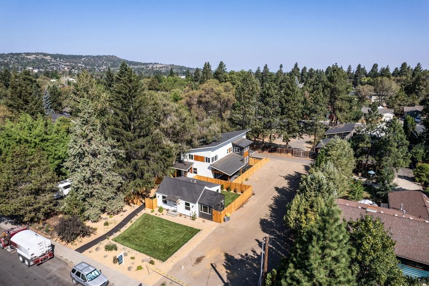 Live your dream in mid-town with a stunning home and ADU totaling 3045 SF or utilize this gem as an amazing investment property! New construction home with 4 brdms and 2.5 baths, great alley access with 2 car garage. 720 SF ADU with partially finished basement offers tons of potential. Designer finishes through out the main home, super functional floorpan with open concept on the main and all bedrooms up, walk-in closet in the primary is second to none! Treat yourself to a personal tour and let yourself settle into your new home. Conveniently located 2 blocks from Midtown Yacht Club. Whether primary home or investment opportunity, this property is sure to satisfy your Central Oregon real estate needs.