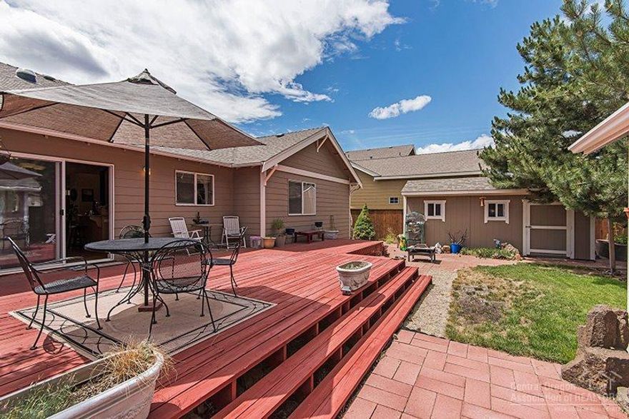 Additional 192 sf Outbuilders finished Artists Studio not included in square footage. Interior updated with Oak pre-finished hardwood floors throughout the living and master bedroom. Granite slab counter tops in the kitchen & extra cabinetry in a vaulted greatroom. Natural light plus 3 solar tubes throughout. Lovely updated home with fenced yard, sprinklers, drip system, large lot with added garden shed 16x8, and RV area. Expansive rear deck & cozy front deck. Fresh paint inside and out