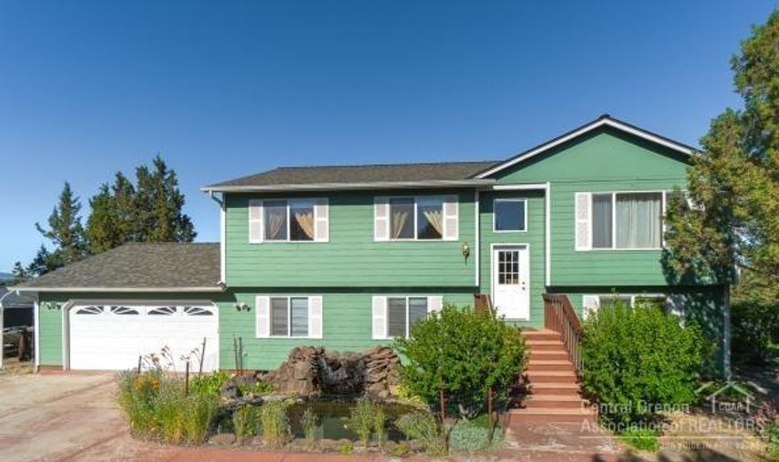 6 bedroom 3 bath home located between Bend and Redmond. Beautiful Cascade Mountain views to the West and southerly views towards Pilot butte. 2.16 Acre lot is fenced and has irrigation system. Home would accommodate multi-generational living. Upstairs living room. Lower level has 22x15.5 Family/bonus room-plumbing in for wet bar & a 14.5x14 Family/bonus room with propane fireplace.