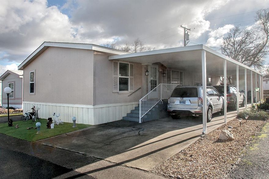 Desirable split-bedroom floorplan home in 55+ park. Open living room, spacious dining area & breakfast bar plus large kitchen with generous amount of storage/countertops & breakfast nook. Big master suite with attached bonus room, walk-in closet, soaking tub + separate shower. New since March 2018: Carpet, laminate in dining/kitchen, vertical blinds & curtains in living room & dining area, master bathroom flooring, 40-gallon hot water heater, washer, dryer, range/oven, garbage disposal, kitchen sink & faucet, master bedroom toilet, extended carport cover, 6'x8' shed (concrete siding), replaced decking/stairs/railing on front entrance & back porches, resurfaced east sidewalk front to back, easy-care artificial turf. Convenient location near restaurants, Costco, groceries, shopping. Park is under new ownership, new name Rogue Valley Meadows, park improvements & clubhouse. Space rent $550/mo includes water, sewer, garbage. Allow 1 pet under 20 lbs & possibly a 2nd pet.