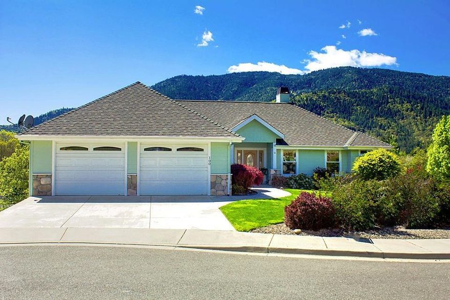 Beautiful custom home with an incredible view of Fielder Mountain seen through the large picture windows in the open living and dining rooms. Wonderful floor plan with many upgrades and features that are hard to find, like extra wide hallways and doorways, handicap bars in bathrooms, cleverly placed storage cabinets, and a luxurious kitchen with island, 2 counter areas, an appliance garage, lazy susan corner cabinet and gas stove. The large master suite features a walk in shower, and a walk in closet accessed through slider doors. A covered deck gives an excellent place to lounge or have an outdoor meal. Laundry room with lots of cabinetry, and an over sized insulated 2 car garage. Beautiful low maintenance landscaping is established and ready for you to enjoy.