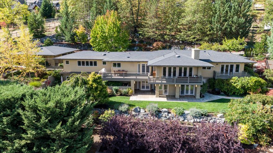 Incredible views and all your main living on one level!!   This stunning home is situated high above Ashland on a one-acre oasis of beautiful landscaping, walkways, patios, and pergolas. It feels peaceful and rural, yet it's only a short distance to Lithia Park and downtown Ashland venues.  Everything has been updated to exactingly high standard by the owners.  From Cat 6 ethernet to top of the line appliances, French doors everywhere to stunning hardwood throughout.  It has floor to ceiling windows in the living room which accesses the deck where you can enjoy the stunning views.  The entire house is open and bright. Three water sources, City water, a well and TID irrigation.  City sewer.  Some of Ashland's best trails are right outside your front door, and it is on a one-way street.  Lots of extra parking at the house for guests.