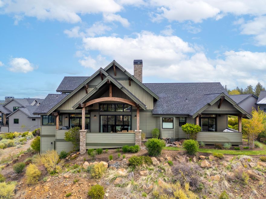Framed by sweeping Cascade Mountain views and open park space, this French farmhouse-inspired home in Tetherow offers a refined take on westside living. Thoughtfully designed with a flexible layout, it features two main-level bedrooms (including a primary suite with dual walk-in closets), a lower-level guest bedroom and bath, and an upstairs flex room with closet which easily doubles as an additional bedroom to accommodate guests, work, or extended stays. Vaulted ceilings and curated finishes echo timeless charm, while the enclosed courtyard patio and rear deck space invite a connection to the landscape. Also, with an oversized mudroom and three car tandem garage with built-ins, there is no shortage of room for your gear. Located on a quiet .40-acre lot with direct trail access and minutes from Mt. Bachelor, the Cascade Lakes, and downtown Bend, this home has a quiet elegance while offering everyday access to the region's best recreation, dining, and resort amenities.