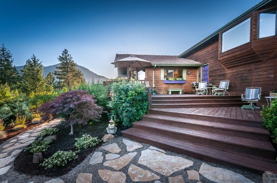 Private home in stunning secluded rural setting. This beautiful cedar-sided home is backed by BLM with views of the local mountains and valley. Living room features a wall of glass windows to enjoy the scenery in every season. Kitchen has been recently updated with stainless appliances, 2 convection ovens, granite island, and butcher block counters. The master suite has a huge bay window, with incredible views, a walk-in closet and bath with dual sinks. The home has a second bedroom and a den which could be used as an additional bedroom. There is an attached 2-car garage with a wall of built-in storage cabinets. High speed internet access is included. Outside there is a charming 500 sq. ft. cottage that has the potential to be a guest cottage or studio. Close by is a workshop and covered storage shed. The lower part of property has room to possibly build a barn or other outbuildings. (buyer to do their own due diligence regarding possibilities) Enjoy the rural setting with the huge