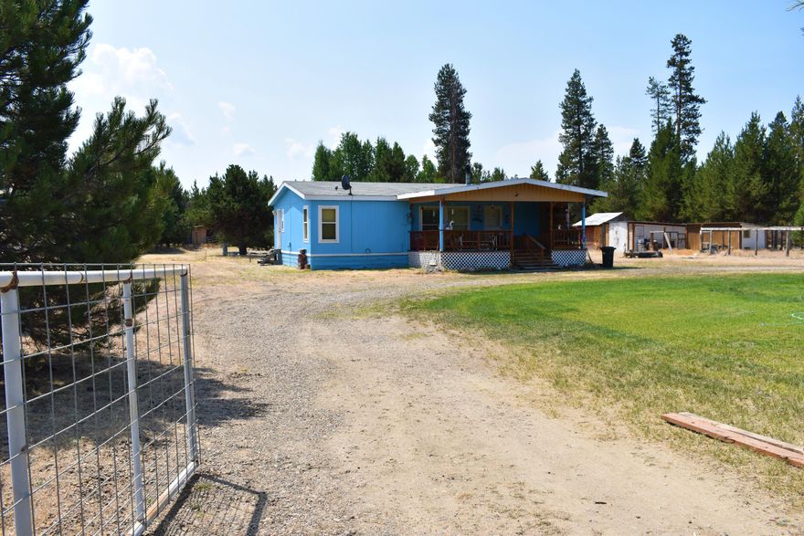 Cute 1994 Manufactured home on just over an acre of land. 3 bed 2 bath 1188 sq foot home. This home has a cute covered front porch and circular drive, fenced and gated. This home has never moved, original to the property. Sun Forest Estates is only 8 miles east of the town of La Pine and is a short ride to town. Located on the Oregon Scenic Byway, a pretty drive! Really a must see at this price!