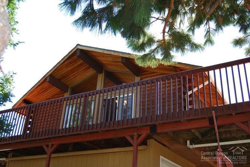 Delightful 2-story log home with wrap-around decks from which to enjoy the panorama of surrounding buttes. Efficient kitchen with glass-top range and breakfast bar opens to roomy living space. Master-bed/bath up, 1-bed/bath dwn. Drive-through single car gar. w/separate shop. Ceramic radiant heaters provide constant comfort, in addition to the Dutch West approved wood stove. Fenced-acre w/entry gates, cross-fence w/gates, fenced-garden w/water, greenhouse, brick patio, paver walks, gutters, newer roof.