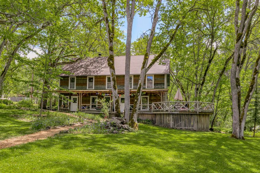 A magical retreat, tucked in the Rogue Valley in Ashland OR, Buckhorn Springs is a 124 acre inholding of the Cascade-Siskiyou National Monument. The property has sustained a thriving business with many returning groups for 32 years. A sacred place where one feels connected to the land and for many who find refuge, beginning with American Indians who gathered on this ground for peace and healing. Nestled among ancient oaks, the retreat center features a restored Lodge, 8 private rooms and commercial kitchen. The Dodecagon, the elemental essence of Buckhorn, is the gathering space for guests. Three masterfully-crafted residences offer private housing opportunities for owner/staff. Thirteen lovingly restored cottages, with Emigrant creek frontage, are complemented with a circular garden, hiking trails connecting to old growth forests, and 1891 irrigation rights. Historic Buckhorn Springs offers secluded refuge minutes to wineries, arts, restaurants and the Oregon Shakespeare Festival.