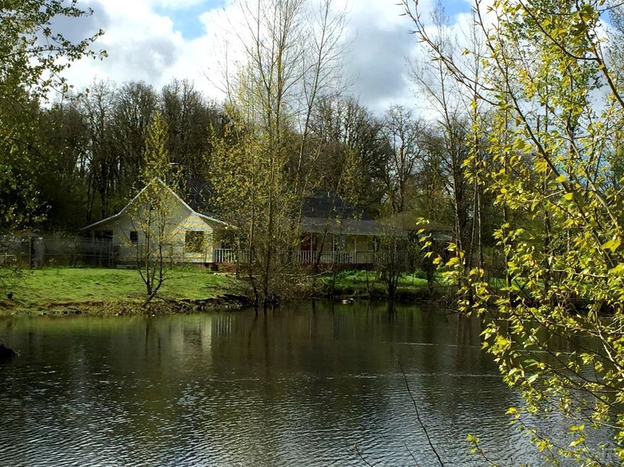 Serene & Private 19.78 Acres w/ large natural pond. Fenced & x-fenced. Property has forestland, pastureland (horses,cows,sheep), 24x48 barn/shop (multiuse building), 30x70 garage (or multiuse carport, shop, garage, barn), stalls... Total Square Footage includes 1 Bdrm/1 Bath Studio w/ separate entrance. Great Mother-in-law (ADU) space. 2626 Total Sq Ft (incl. adu) 4 Bdrms/3 Baths. Many, Many Outbuildings. The possibilities are endless. Newer roof, heat pumps (2), GREEN marmoleum & acacia hardwood floors.