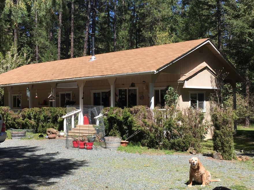 Very peaceful quiet setting among tall fir and pines , this 2.5 acre parcel has many trees open areas with lots of quiet! Double car garage guest room, is fenced and cross fenced. Circular drive RV parking multiple sheds. Home has a large covered porch inside is immaculate this is a single wide mobile home wrapped up neat and clean