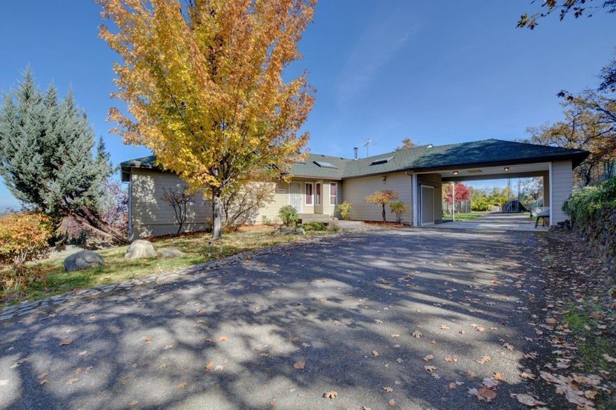 Looking for Green Living on Private, Quiet, and Rural Property? This 3 bd/3 ba - 3441sq ft country VIEW home sits on 6.46 EFU acres, with TID irrigation - 3.4 Acres (2 ditches - upper/lower). Daylight Basement has private entrance, perfect for multifamily living. Home is heated and cooled with Geothermal energy, has Tankless hot water heater, and 80% of home electrical received from 24 Solar photovoltaic panels. Two outbuildings, including a small barn, and a large fenced sunny garden area. HUGE RV Parking for 3 vehicles, including 30 and 50 amp service, potable water, and dump station. . This property is fenced and cross-fenced; allowing the perfect set-up for crops, horses, and other animals/livestock. Property includes buried irrigation pipe, pressure provided by falling irrigation head, and can be supplemented with an additional electric pump, and fire suppression system. Too many extras to list! Country Living, just minutes to downtown Medford, and neighboring communities.