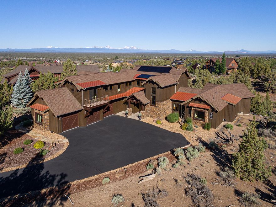 Life at Brasada Ranch is an extraordinary experience made even better by this luxury home. Step into the sunny great room with huge Cascade Mountain views leading to outdoor living on the extensive deck. Love entertaining with the open floor plan and cozying up to the stone fireplace, cooking in the gourmet kitchen and coffee in the breakfast room with views you want to wake up for. The office and gorgeous primary suite are on the main floor, with the  loft and 2 en suites upstairs, creating nice separation for guests. Energy efficiency is maximized with a 2019 solar panel system, Tesla car charger, upgraded WIFI and remote-controlled heating system, and new air purifiers for both furnaces. Enjoy Brasada Ranch amenities (membership required at addl. cost) and trails, and your easy going, yet 5-star lifestyle.