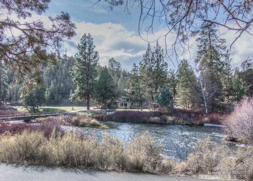 Spectacular acreage on the Deschutes 4 miles from Bend. Over 1/4 mile of river frontage accessed by private bridge. Bordered by public land & essentially inaccessible to the public except by water. Acreage provides access to literally miles of wading & fishing. House is rough, but preserves the right to build a new home in existing location. Zoning ordinances preclude building of homes within view of this home site. Huge potential for tax benefit via Conservation Easement. Awesome fishing & swimming holes!