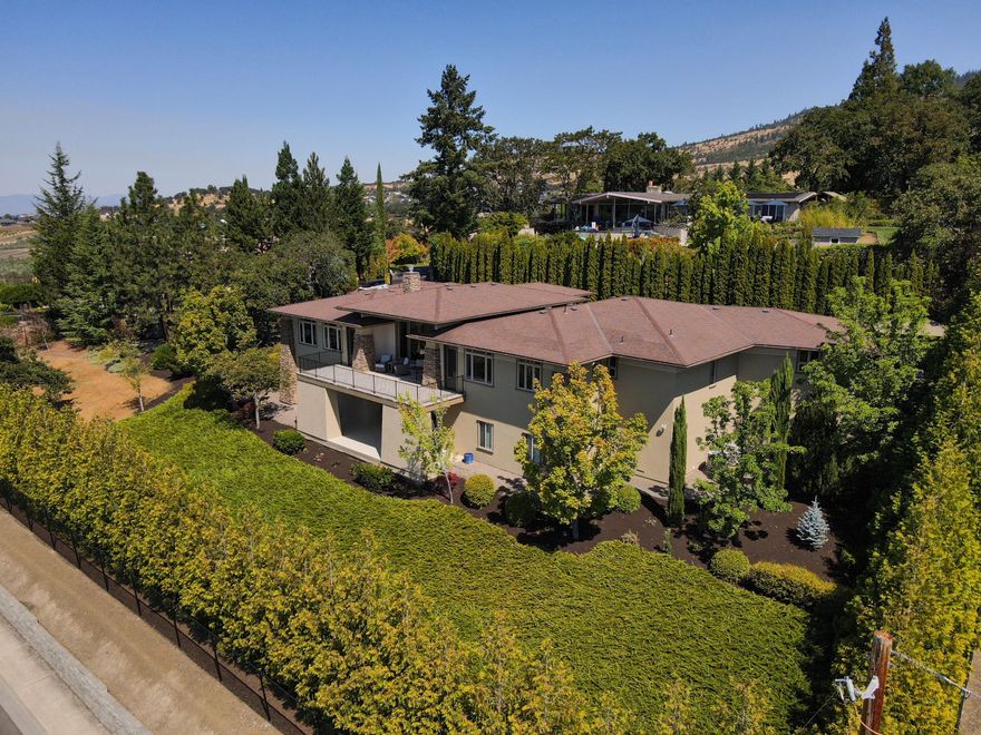 This prestigious property showcases quality craftsmanship and breathtaking panoramic views of our valley and mountains! Beautiful 3 bed 2 bath, 3,039 sf home includes additional office & 1,439 sf of finished flex space downstairs sitting on .72 acre of fully irrigated landscape. The kitchen features granite countertops, natural cherry cabinets, an island, a breakfast bar, and all-new appliances. All rooms offer built-in closet shelving. Spacious primary suite, dual vanities, makeup vanity, jetted Jacuzzi tub, and oversized shower. Hardwood floors, 8-ft solid oak doors throughout, high ceilings, upgraded casement windows, floor to ceiling fireplace, and new interior/exterior paint. Oversized 3 car garage. Outdoor living shines with low maintenance natural landscape, multiple sitting areas, gazebo, raised garden beds, Koi pond, garden shed, and two patios. This home is move-in ready, overlooks a winery, is less than 10 mins from 2 major hospitals and is truly one-of-a-kind! Tour today!