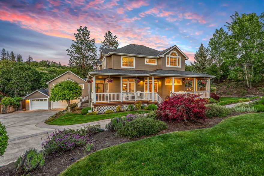 Back Up Offers Welcome!  Buyer's Commission Welcome!  Discover the epitome of craftsman elegance in this custom-built residence nestled in the serene hills of Ashland. This home is a unique treasure offering the convenience of being just a stroll away from the verdant Hald/Strawberry Park and a network of trails.  Set on a generous half-acre plot, the property boasts a meticulously landscaped garden and splendid 736 square-foot guest house.  The main residence, spanning 3,248 square feet, is a testament to the open concept living with its expansive hardwood floors and abundant windows that bathe the interior in natural light, offering views from every vantage point.  The sunken living room, with its inviting stone fireplace, opens to a tranquil patio, complete with a pond and secluded sitting area.  The kitchen is a chef's delight offering Quartz countertops and stainless-steel appliances.  The property also includes an in-ground, heated pool and hot tub