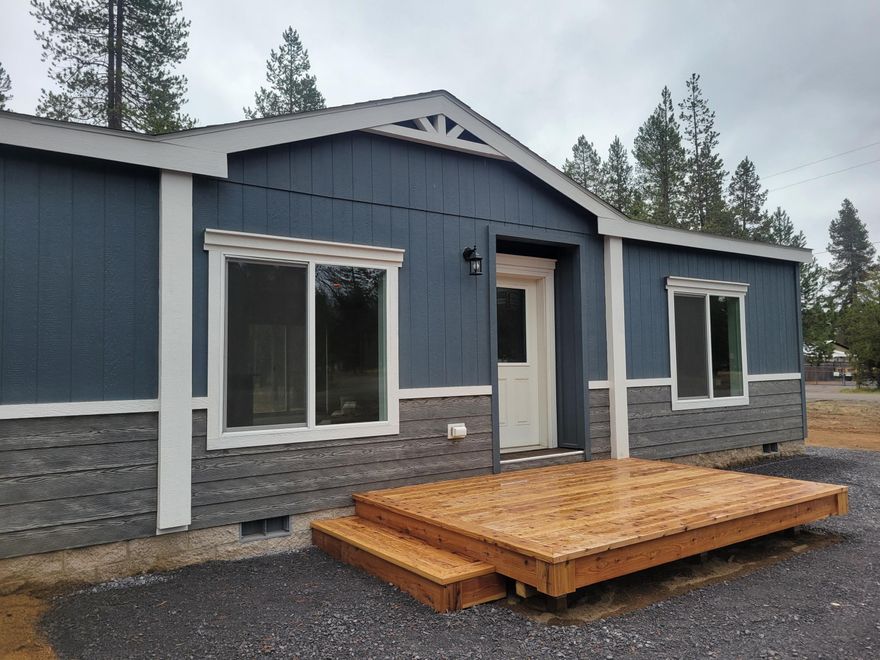Welcome Home to your brand new 1608 sqft. 3 bdrm/2 bath manufactured home on .95 AC corner, wooded lot near 
Pringle Falls & Cascade Lakes & Resorts! Country living but near shopping, medical, city conveniences, La Pine State Park, East lake, Paulina Lake, Wickiup Reservoir. New well & ATT Septic System! Primary ensuite separated from guest quarters w/dual vanity, soaking tub, enclosed toilet. Open concept Great Rm w/Kitchen island, Stainless appliances & a hidden, BIG pantry. All bdrms w/ walk-in closets. Large windows bring in the outdoors & wooded views.
Lots of counter space & storage for you to organize, prepare your tasty meals & entertain! Cedar front & back decks. Graveled, Circular driveway! RV Parking, Room to build a shop!  No HOAs!