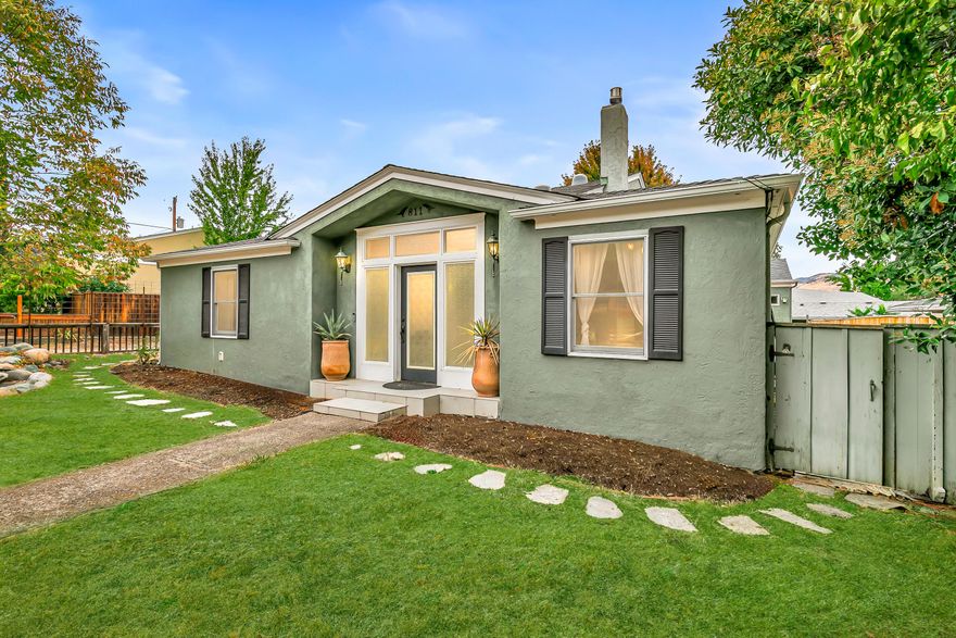 Built in 1930 and brimming with warmth, this 2,300-sqft Ashland home offers 3 bedrooms, 3 full baths, and a large den that could easily become a 4th bedroom. With an attached apartment, you'll have the perfect space for family and friends - or even a short-term rental opportunity. Inside, you'll be greeted by timber floorboards, high ceilings, and rustic beamed accents that create a sense of timeless charm. The living room centers around a welcoming fireplace, while the stainless steel kitchen opens effortlessly to the dining and living areas, making entertaining both easy and inviting. An unfinished 700-square-foot basement adds even more flexibility for hobbies, fitness, or extra storage. Could your ideal retreat be a primary suite with a private bath and walk-in closet? Here, you'll find exactly that—alongside additional bedrooms, a sitting room, and a spacious family room designed for comfort and entertaining. Just 0.8 mile to Downtown Ashland! Inquire for more details!