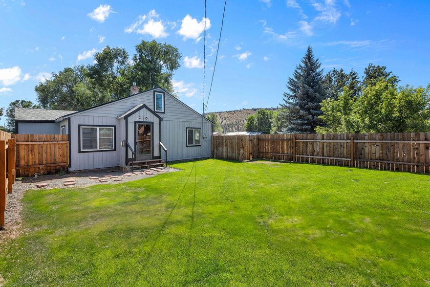 Charming single-level home on a large 0.39-acre lot in a quiet Prineville neighborhood! This property is fully updated with newer roof, septic, floors, kitchen paint and more. The spacious yard features a new fence, mature trees and plenty of room to build a shop, garden, or entertain. Plumbing infrastructure for water has been added behind the home to accommodate RV parking or a future garden. Close to schools and just minutes to town. Perfect for first-time buyers, downsizers, or investors looking for value and opportunity.