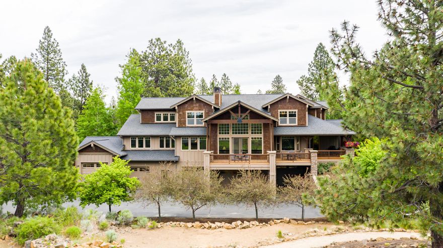 Exquisite custom Northwest style home in the gated community of Sunset View Estates. Located in a cul-de-sac backing common area & 3rd fairway of Lost Tracks Golf Course. Cascade Mt. Views! Fabulous center island kitchen, granite counters, subway tile backsplash, knotty Alder cabinets, breakfast bar, pantry & top of the line appliances. Hickory hardwood floors, huge great room, stone fireplace, formal dining room, breakfast nook. Master suite on the main level, large walk in closet, double tiled shower, heated floors, gas fireplace. Lots of storage and custom woodwork throughout the home. Wonderful family room features a fireplace and ½ bath, good sized junior master suite & loft area. A car enthusiast's dream offers parking for up to 8 vehicles. Heated garage, shop area w/ 220 electric, office, ½ bath, single bay with ''Rotary Car Lift'' and 14' ceiling. Covered front porch, wonderful large mahogany deck. Beautiful landscaping, lush lawn, rock outcroppings, paver patio with a fire pit.