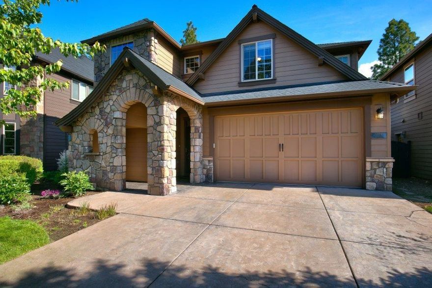 Beautiful Stonegate home with MASTER on the MAIN. Open great room with stack stone gas fireplace and ceiling fan. Spacious kitchen with breakfast bar, tile counters, newer stainless steel appliances (2017) to include a double oven range. Wood floors in entry, kitchen and dining area. Master has a ceiling fan, bath with dual vanities, tile counters, tile floors, walk-in shower, soaking tub and a walk-in closet. Large 4th bedroom has a  closet, double doors and would be perfect for a bonus/media room. Other features include wrought iron staircase, new interior paint on main level, new roof in 2016 and AIR CONDITIONING. Enjoy the fenced backyard with covered stamped concrete patio. Community has a pool, clubhouse and playground. HOA maintains the front yard landscaping and snow removal of the private streets.