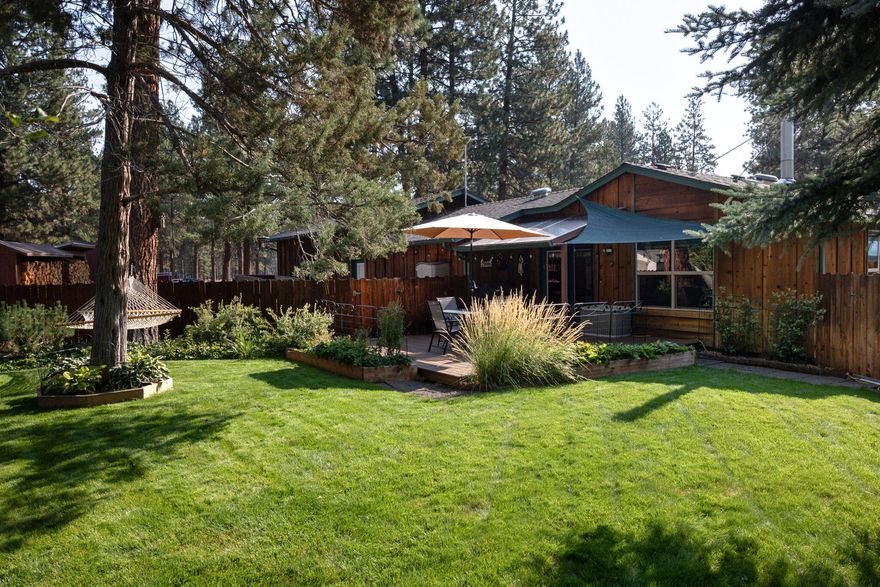 This is hands-down one of the most well-maintained homes you'll ever step into—truly cared for with a level of love and attention that's rare to find. While it may be an older home, it shines with pride of ownership inside and out.

Located in a highly desirable subdivision, the entire subdivision is Firewise certified, offering peace of mind in every season.

The property itself is a dream—meticulously landscaped with a 7-zone sprinkler system, fenced yard, Fiberon composite deck, and a newly chip-sealed and coated driveway with plenty of parking. An RV hookup and dump station make it perfect for adventurers.

Inside, you'll find beautiful pine floors, a cozy yet functional layout, and an actual two-car insulated garage (yes—it really fits two cars comfortably!): 3 bedrooms plus a bonus room. Significant upgrades have been taken care of, including a newer roof (2017), a septic tank replaced in 2020, and a fully restored drainfield.

Mt. Bachelor and HooDoo close by.