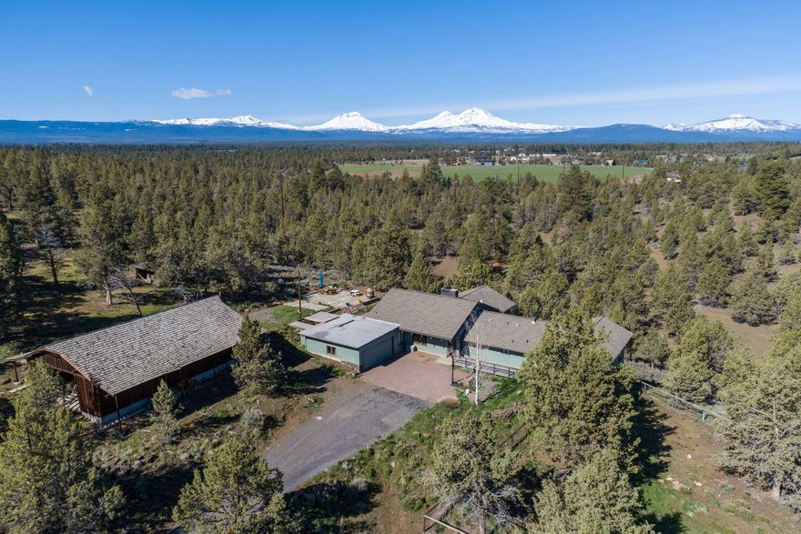 Once-in-a-lifetime chance to own a home on your own private nature preserve located between Sisters and Bend.  Established as a private conservation easement with Deschutes Land Trust, this property is a one-of-a-kind 75-acre estate with towering Cascade Mountain views, where migrating elk traipse among an old-growth juniper forest, and where you can gaze at the majestic sunsets.  The 4 bedroom, 3 1/2 bath 3370 sq ft home features vaulted wood ceilings, large windows, and a large rear deck to take in the Central Oregon of yore.  With unmatched beauty and minimal property taxes, this setting is the real deal, all on the flank of your own private butte.