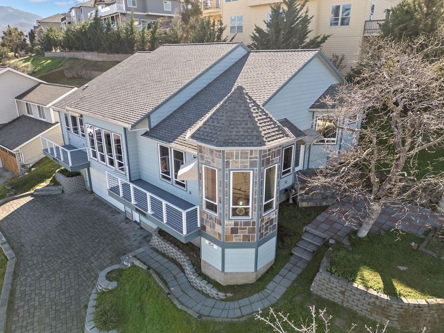 Elevated Living with Breathtaking Views! Take in the scenery from the expansive south-facing windows or step onto the balconies to soak it all in. Located in the charming town of Phoenix, you'll love the growing community vibe, with exciting new small businesses popping up. This home is perfectly situated between Medford & Ashland. You'll find 3 bedrooms on the main level, with stairs leading down to a spacious garage & a versatile bonus space, perfect for an office or potential 4th bedroom. Newer Energy Star HVAC system, complete with HEPA filtration! The lower level also features a half-bath & a separate entrance for added convenience. The chef's kitchen is a dream, featuring granite countertops, a raw marble slab island, & a high-end gas stove. Grade A maple flooring flows throughout the main living space, adding warmth & elegance. The community has a big dog park and the backyard of the home is equipped with an enclosed dog run. This home is a must see!