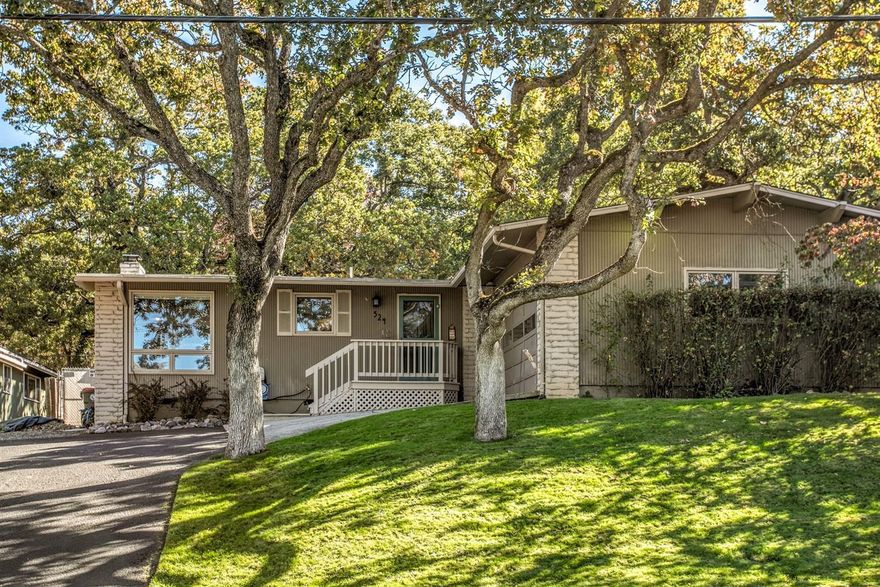 Beautiful, private, mid-century home on mature, tree-lined street! Main floor plan features an open vaulted ceiling and an updated kitchen with granite counters, cherry cabinets, an island, convection oven and built-in refrigerator. Large windows grace the main living space which includes freshly painted interiors and a wood fireplace. The private master bedroom features patio doors out to a brand new deck and an ensuite bathroom. The fenced in backyard is a gorgeous oasis with mature oak trees and lawn which backs up to the city's reservoir parcel. Two rooms and a half bath downstairs round out the home. Come see this great property before it's gone!