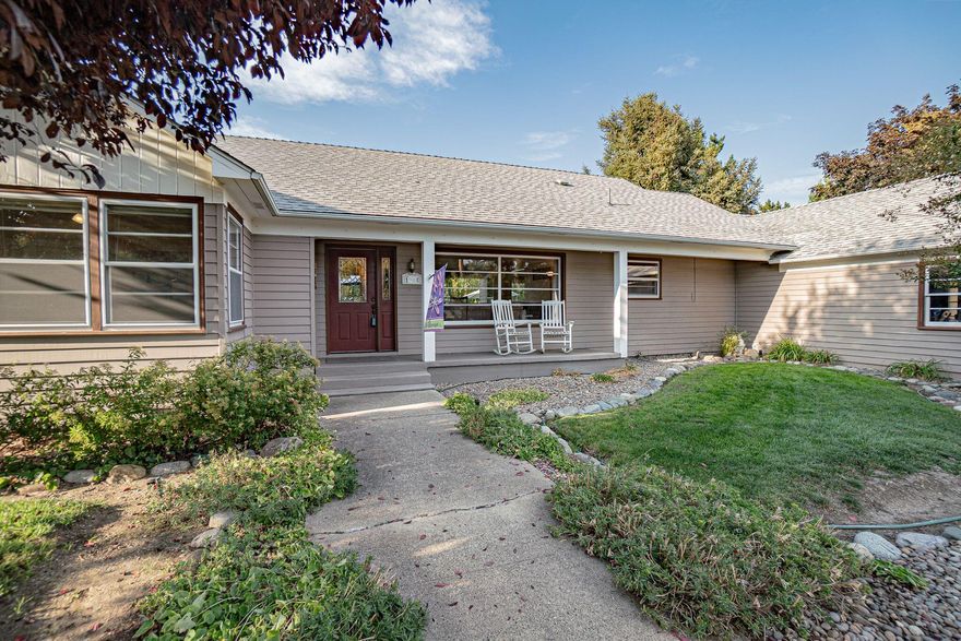 Open House 9-14 11-1p. Beautiful .54 acre of lush grass, planters and Creekside irrigation right in town! This mid-century home has been lovingly cared for over the years, embracing the character of its original charm with upgrades to match today's style. Stunning large windows capture the light of the day, bringing in all that the views while the gas fireplace will keep you cozy by evening. You will find 3 bedrooms, 2.5 bathrooms, 1517 sq ft with beautiful hardwood flooring in the main living areas. The abundant kitchen has solid wood cabinets & tastefully updated flooring and countertops with a bright adjoining dining on one side and laundry/mudroom ½ bath and 3rd bedroom offering a place for MIL or guests if desired on the other. The primary ensuite is made up of incredible view windows, a dressing room and dual closet areas. Tons of parking, circle driveway and mature landscaped with optional pool. There is a well and septic however city sewer and water are stubbed at the road!