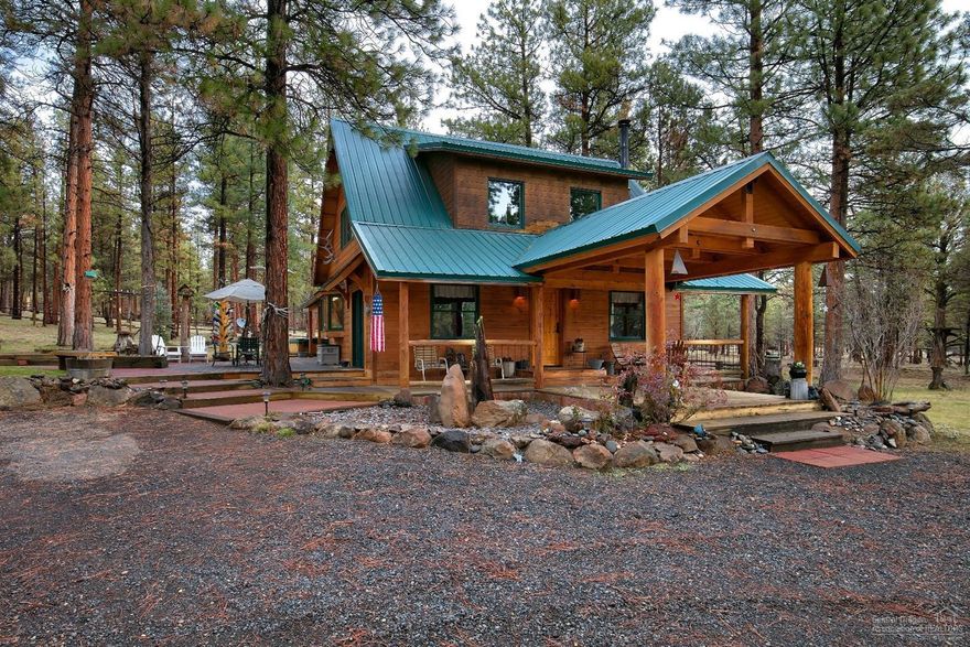 Become enchanted with this 2088sqft home nestled among the pines in Sisters Oregon. On nearly 5 acres, this Stunning home exuberates character with sprawling blue pine ceilings and walls, original brick from the Redmond stockyard, rusted metal accents and vast wood beams.The open kitchen invites you to the grand, vaulted great room featuring log accents and natural light. Main floor living with additional bedroom and large loft upstairs. Complete with detached garage, large shop and 2 stall barn.