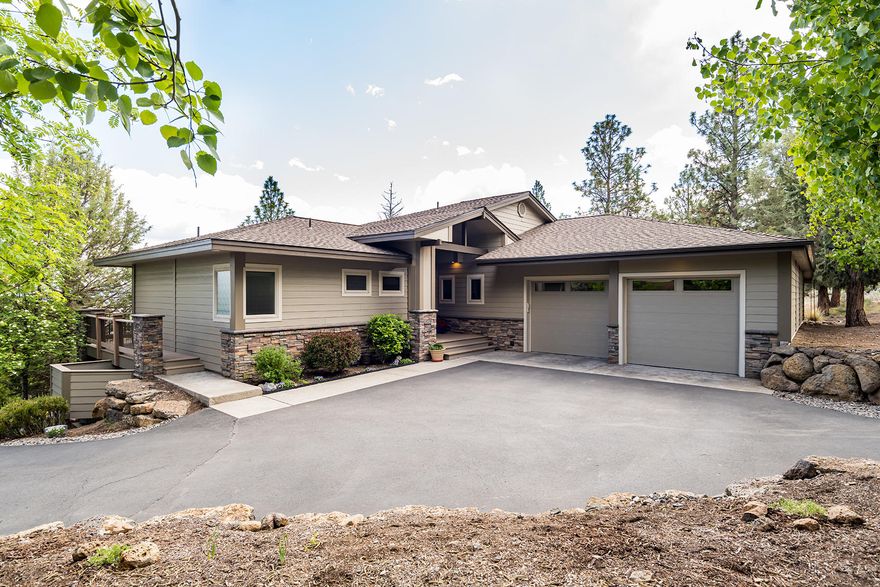 Perched on a gently sloping lot in desirable Fairway Heights with sweeping easterly views this pride of ownership and a meticulous attention to detail are evident throughout this exceptional custom-built home with warm radiant floors throughout. Intricate masonry, elaborate woodwork, and high-end finishes demonstrate a commitment to fine materials. The great room features vaulted ceilings and a built-in floor-to-ceiling stone stacked gas fireplace. In the gourmet kitchen, a stainless steel appliance package, slab granite countertops with a raised kitchen bar. Spacious mudroom/laundry with garage entrance keeps the snow and the dust outside. The main level master suite offers an office niche, tile countertops, a walk-in shower, an oversized soaking tub, and glass door with access to the wrap around deck. Outside, enjoy a fully-landscaped lot with established, fully-mature trees and a built-in fireplace for entertaining.  Attached oversized 3 car garage for all your toy