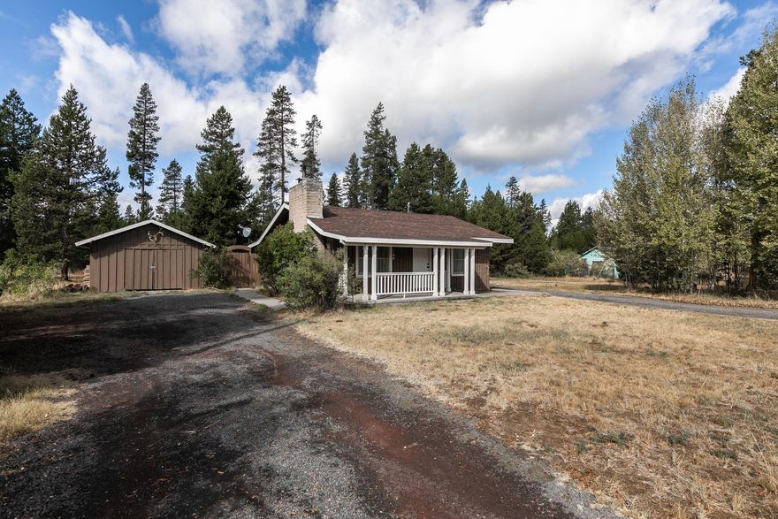 Cozy cabin close to Rosland Grade school and Wickiup Jct. has just the right mix of county and city. Some recent updates, but still some updating needed for the DIY-er. 
Quaint cabin ambiance and perfect starter home or investment/vacation property.
Covered front porch, attached carport plus a detached garage/shop with electricity.   Easy access to Hwy 97, just 1 lot off Burgess Rd. and within city limits, so will be part of the city's sewer/water expansion. Septic & Well are installed and functional.