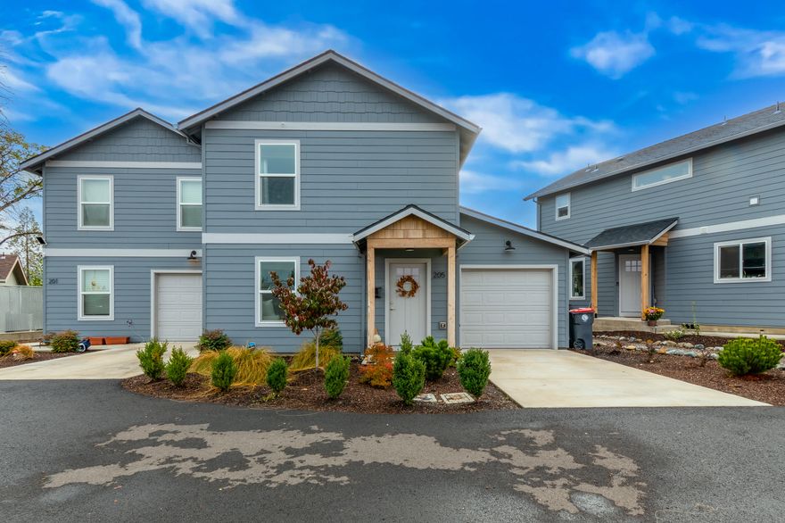 Welcome to 205 Dano Dr - a beautifully maintained end-unit townhome combining modern living with thoughtful design. Built in 2022, this like-new residence offers 1,600 square feet of move-in-ready space. The main level features an open floor plan with granite countertops, sleek laminate flooring, and a convenient first-floor bedroom with full bath—perfect for guests, a home office, or multi-generational living. Upstairs, discover double primary suites ideal for roommates, families, or your private retreat. A small loft provides space for reading or work, while upstairs laundry keeps daily living efficient. Outside, enjoy your private patio overlooking peaceful open space and an annual creek beyond. The attached one-car garage adds security and convenience. Whether you're starting your homeownership journey or seeking a smart, turnkey investment, 205 Dano Dr delivers quality, comfort, and value in one exceptional package.